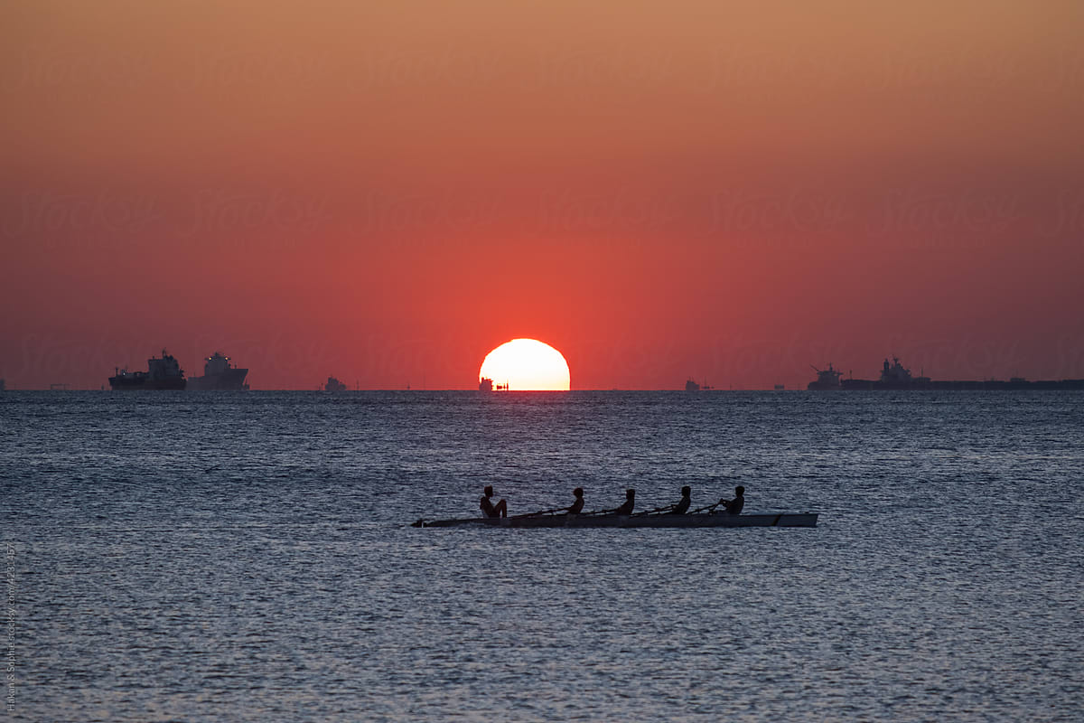 rowing team sunset