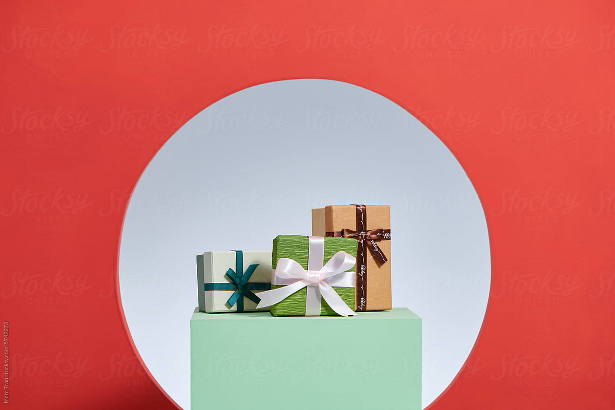 Many bright gifts isolated on a color background.