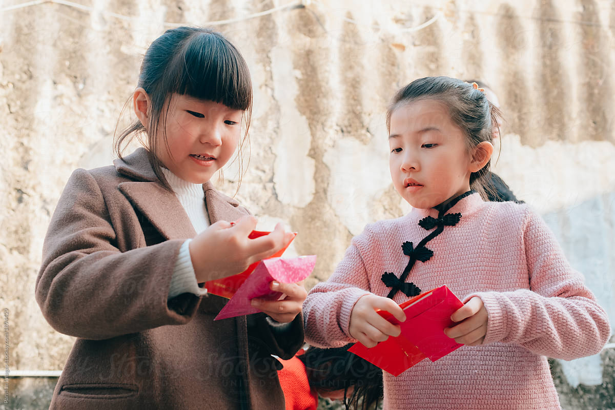 happy Chinese little girl with red packet