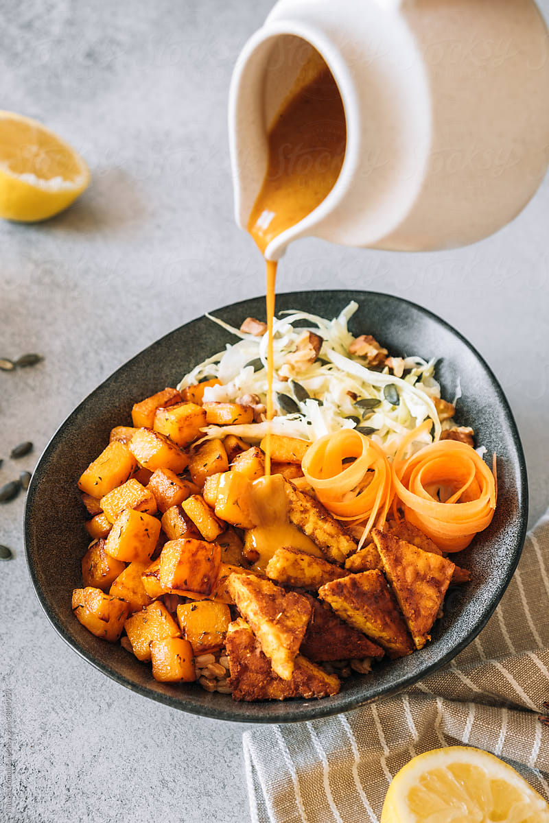 Sauteed pumpkin with spicy tempeh and fresh salad