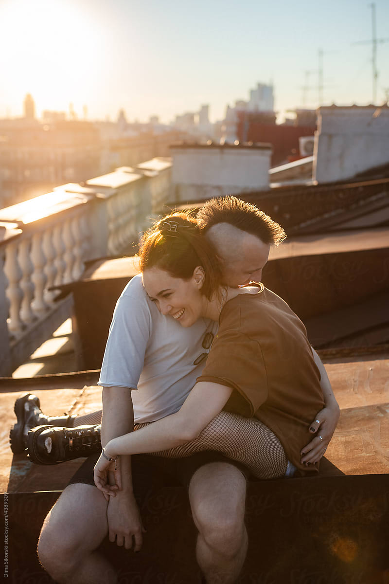 a couple in love hugging on the roof