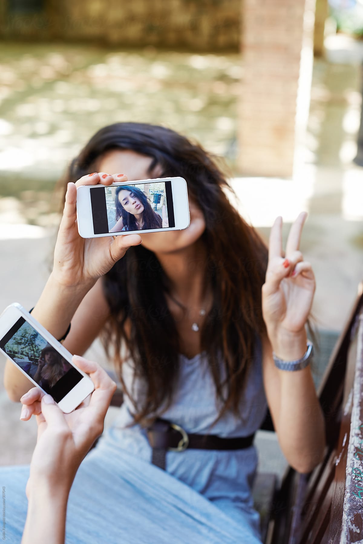 Girl Showing Selfie Photos By Stocksy Contributor Guille Faingold Stocksy 