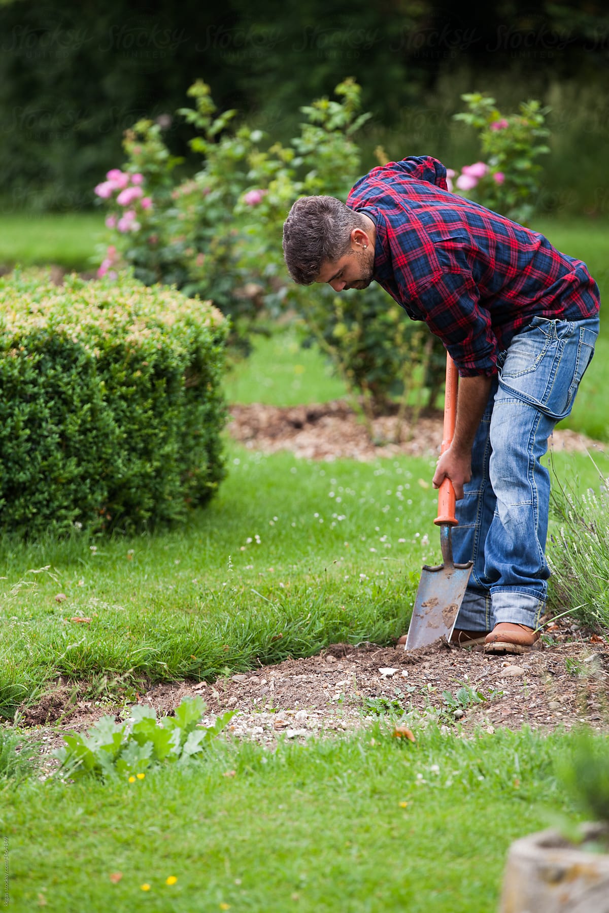Man digging flowerbed