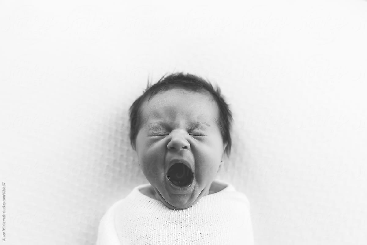 Black and White Image Of A Baby Yawning