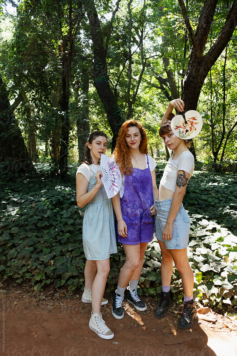 Three Friends Delight in a Casual Day in the Park