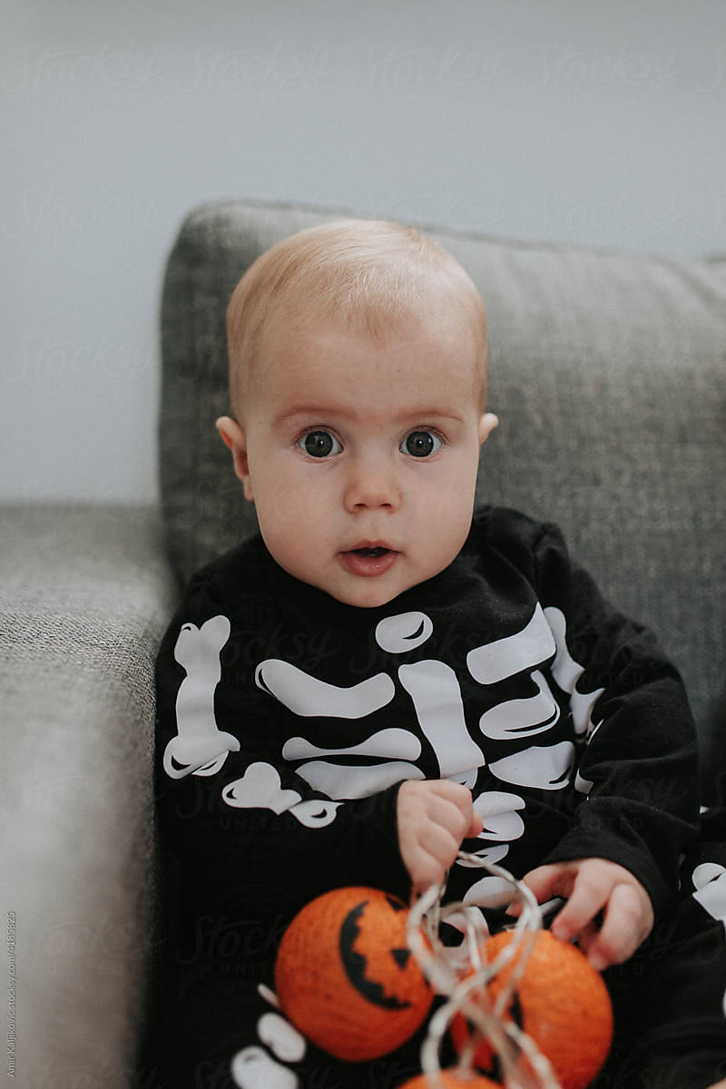 Cute little baby boy in a skeleton costume for Halloween