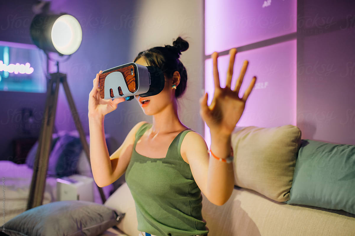 Asian Woman wearing virtual reality headset