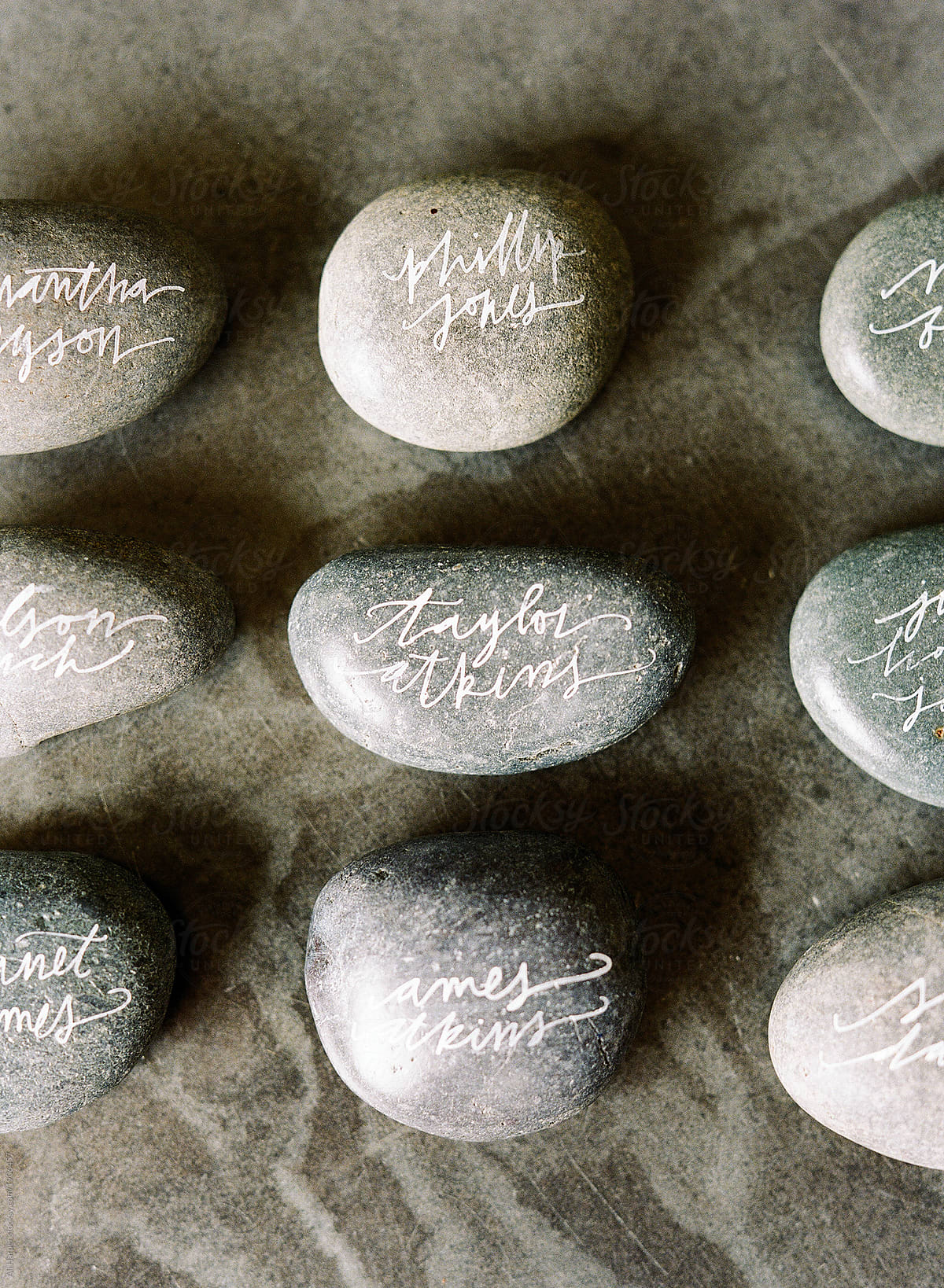 River rocks with fake names done in beautiful calligraphy