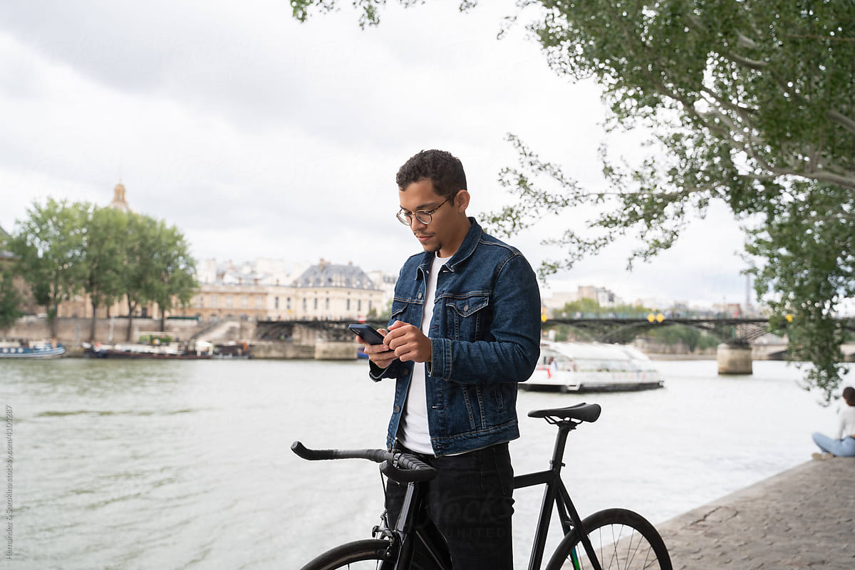 Man On Bicycle Using Smartphone