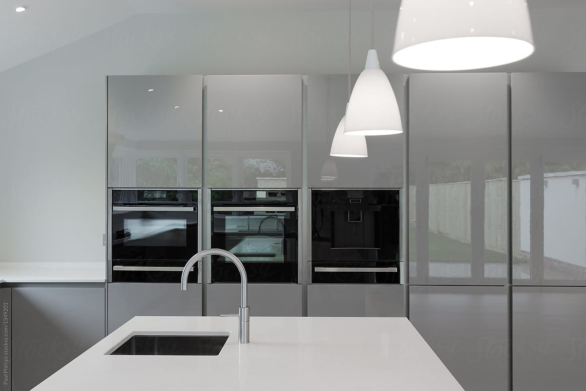 Contemporary kitchen appliances integrated into fitted units.