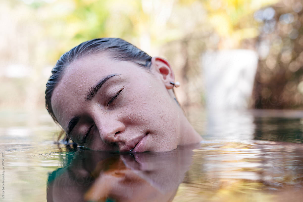 Young woman resting in clean water