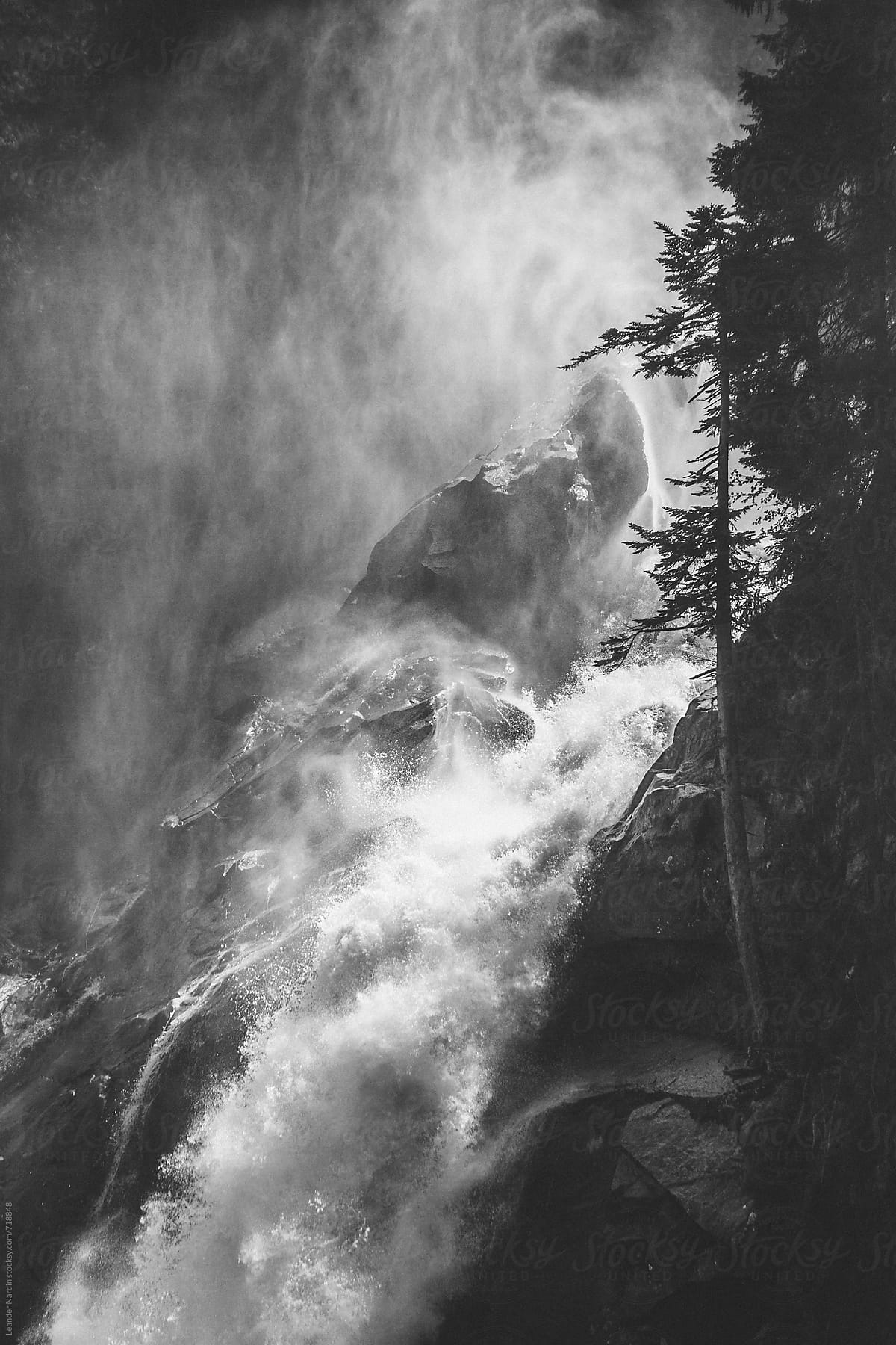 detail of a powerful river flowing down a mountain - black and white