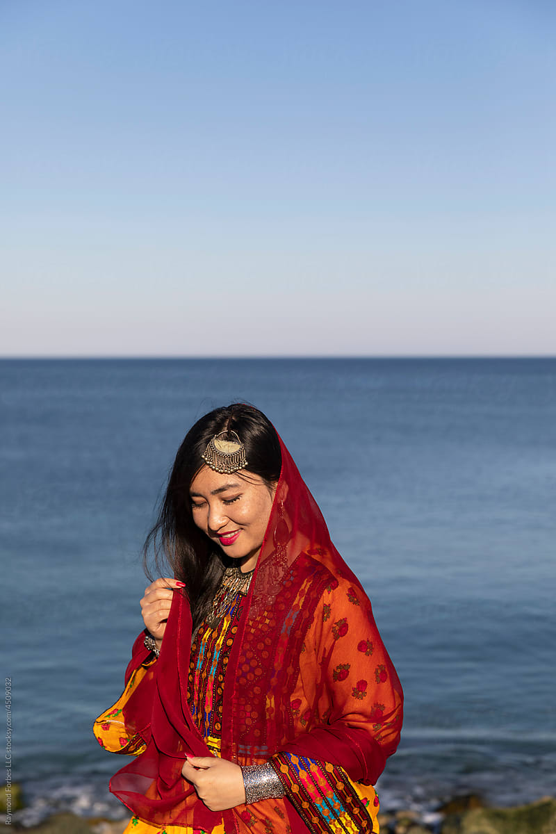 Young Afghani Woman Portrait in Traditional Dress by the ocean