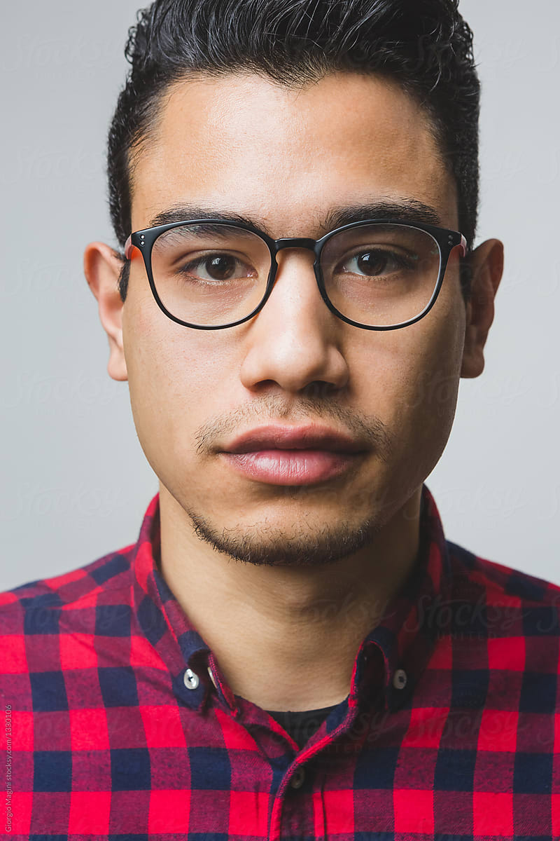 Portrait Of A Mixed Race Young Man With A Plaid Shirt Del Colaborador