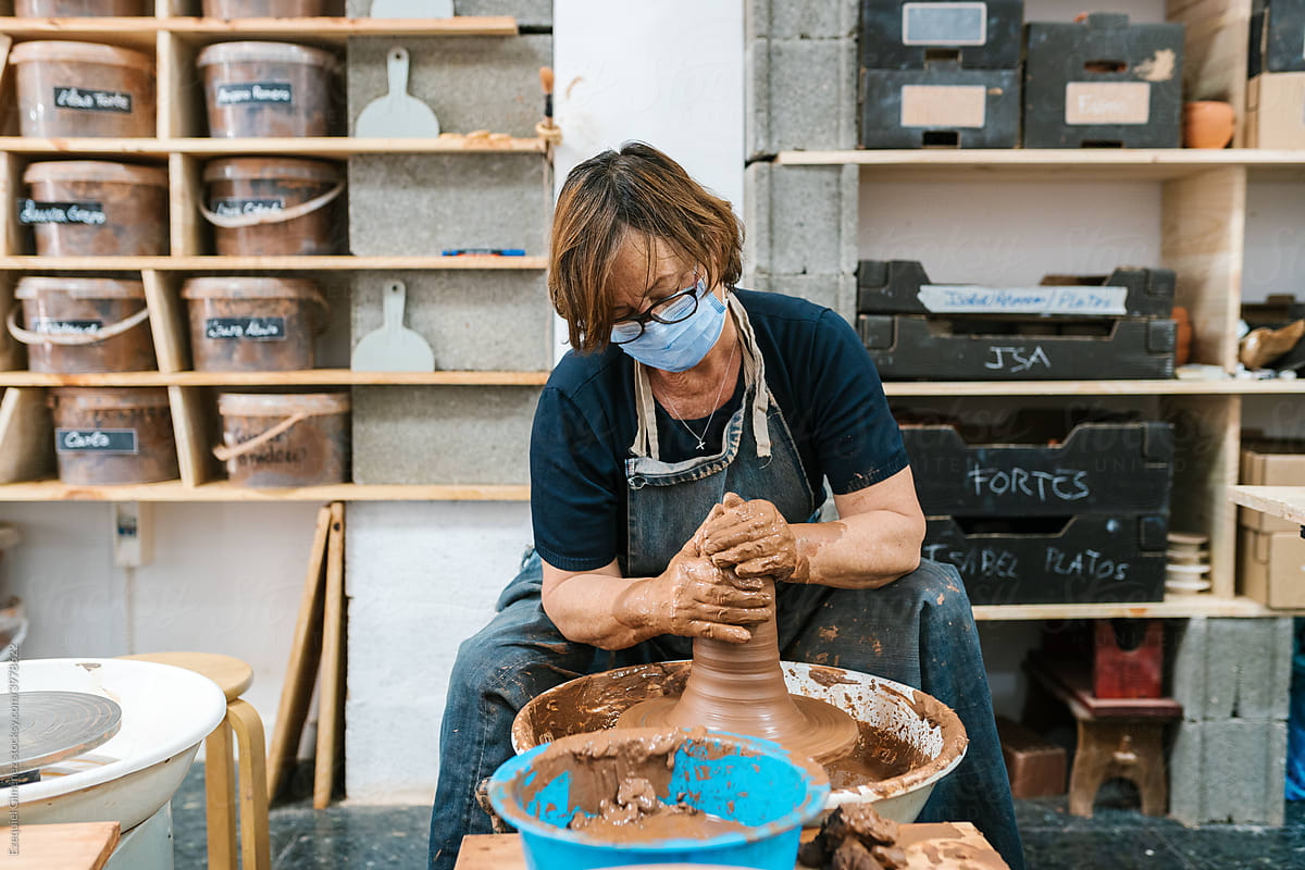 Mature woman making a handmade vase