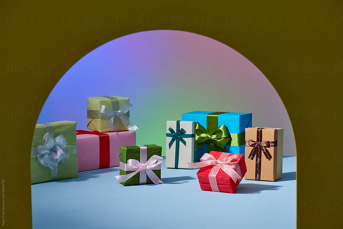 Many bright gifts on a color background.