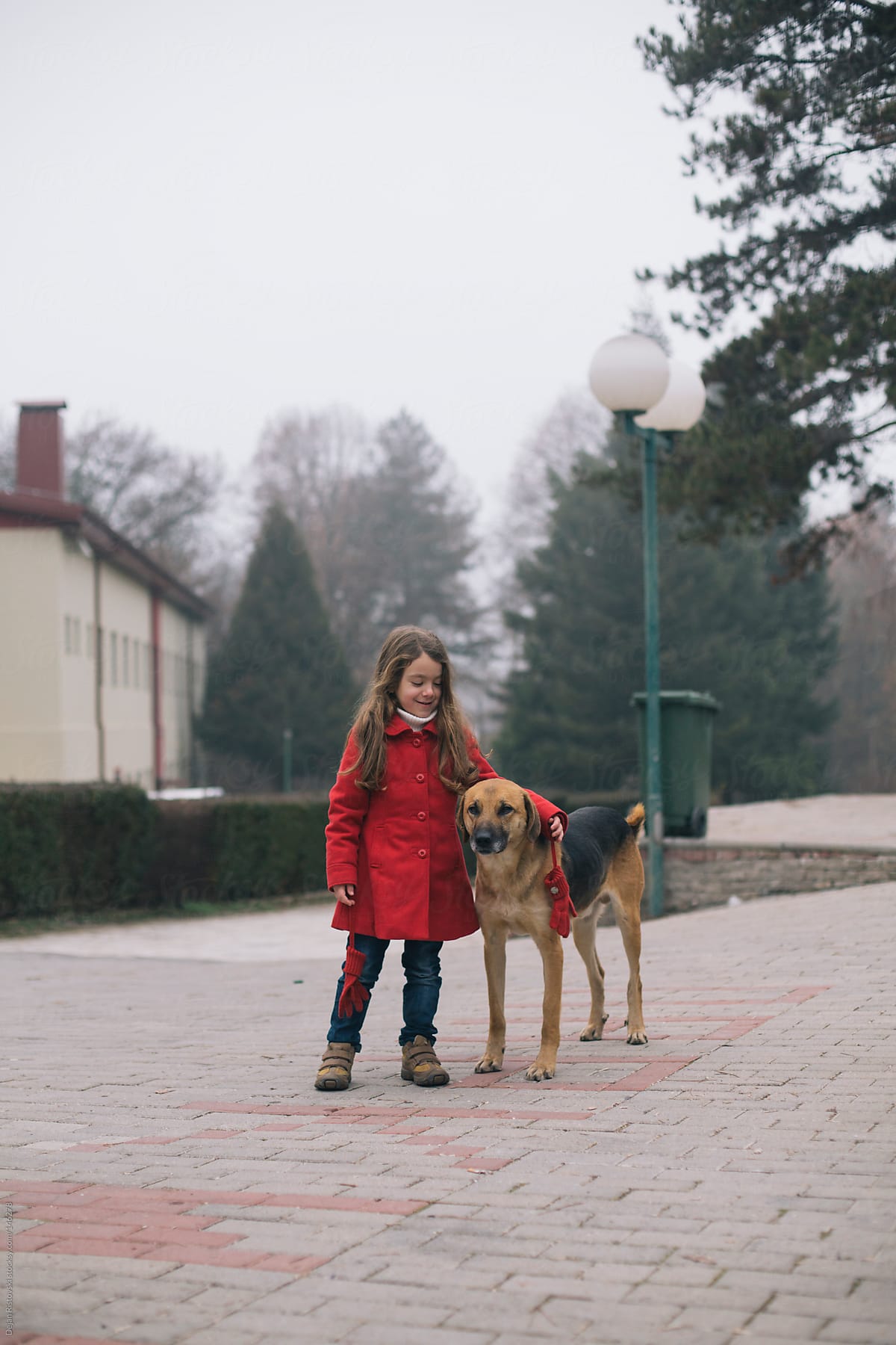 Girl with stray dog