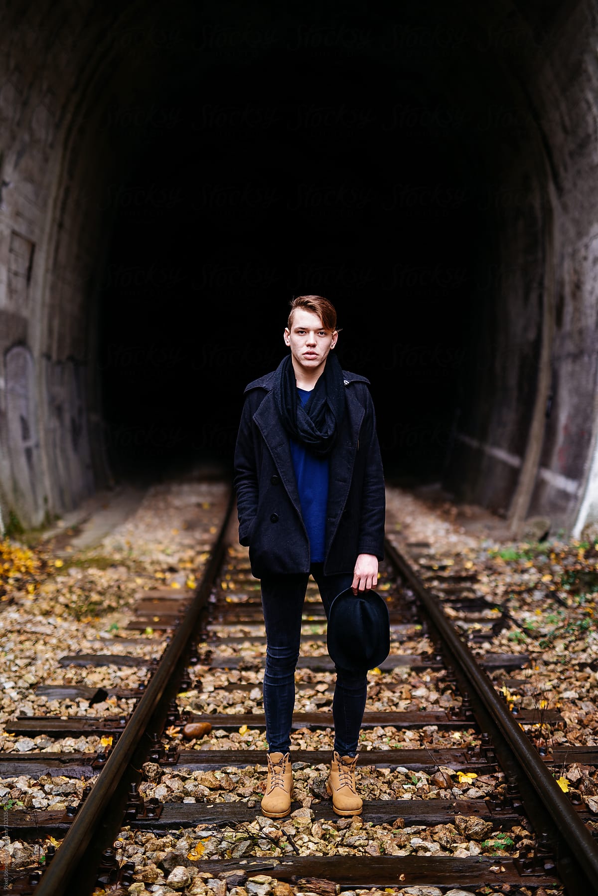 Premium Photo | Caucasian teenager posing near on railway track, freedom
