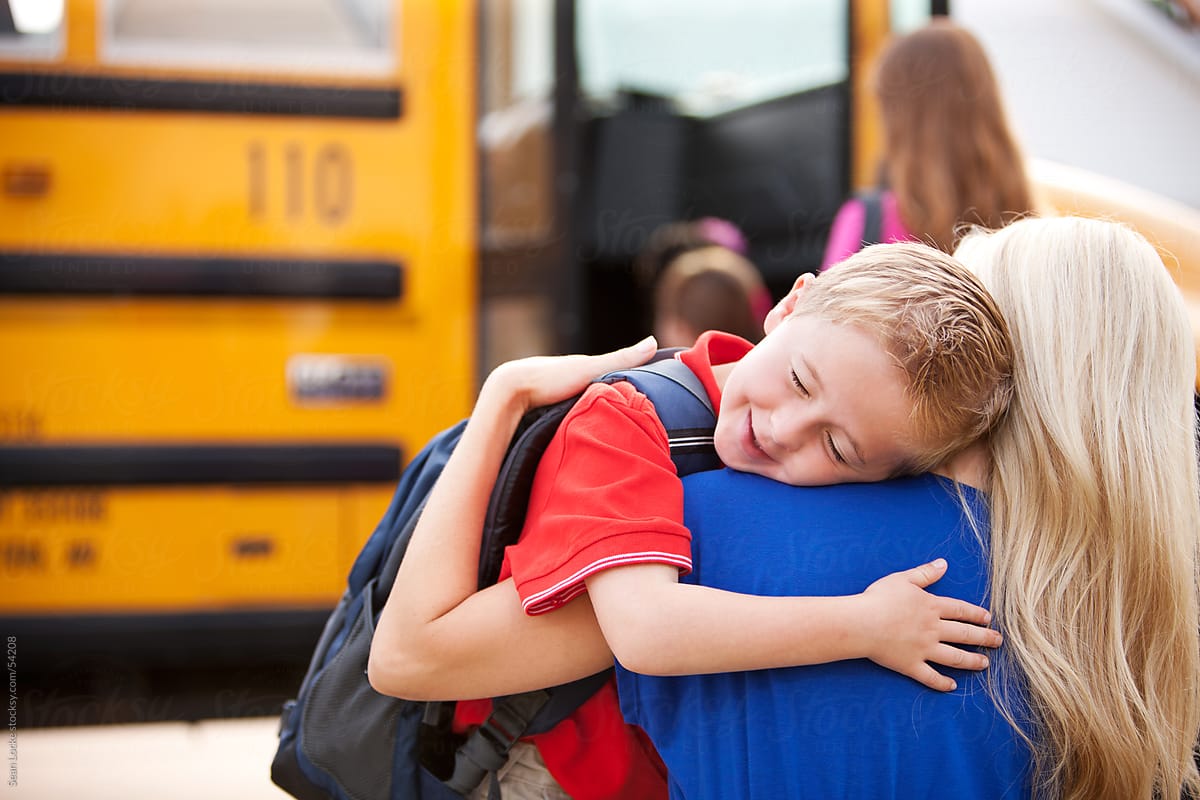 School Bus: Boy Hugs Mother Before School