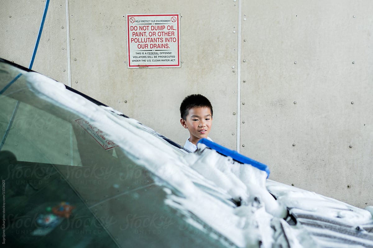 Asian Kid Washing A Car At A Car Wash by Stocksy Contributor Take A Pix  Media - Stocksy