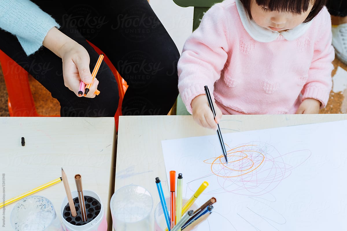 Cute Asia little girl learning drawing