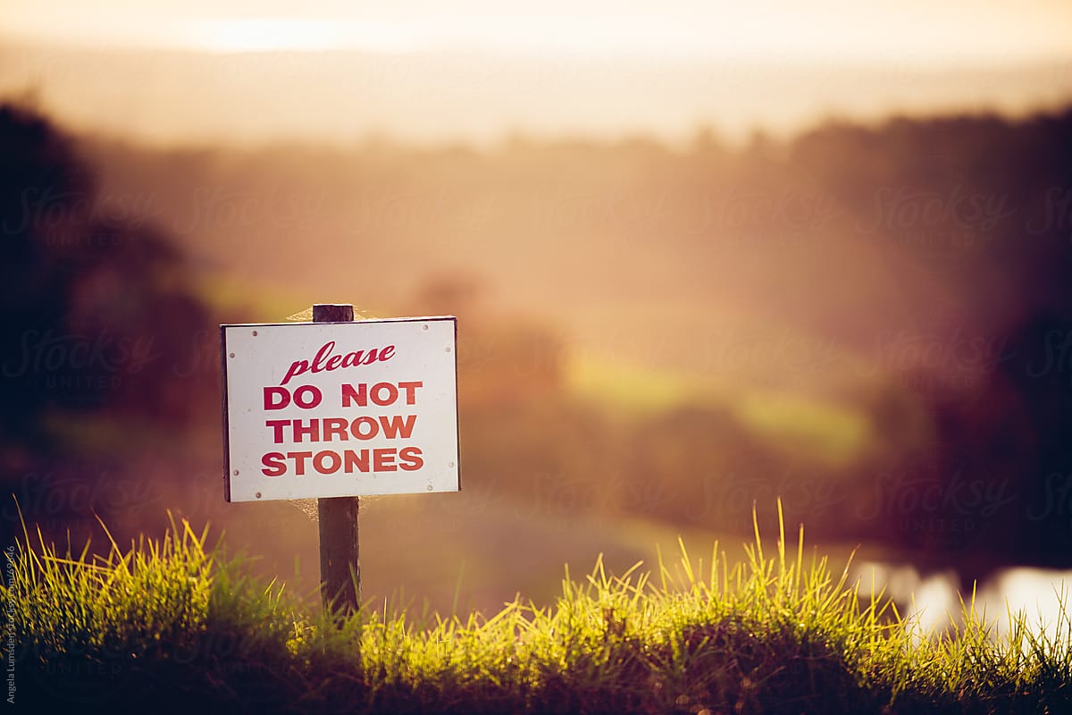 Sign in a country setting at sunset