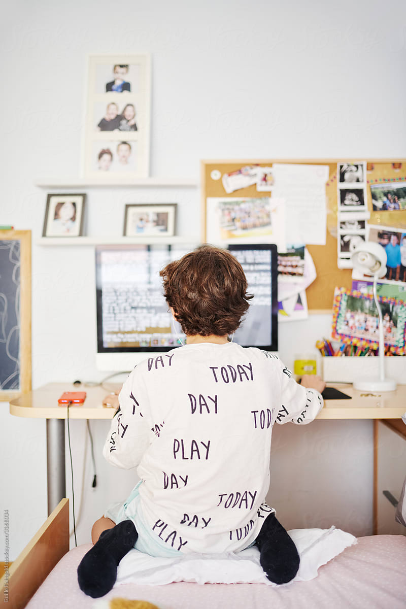 Boy coding in his room