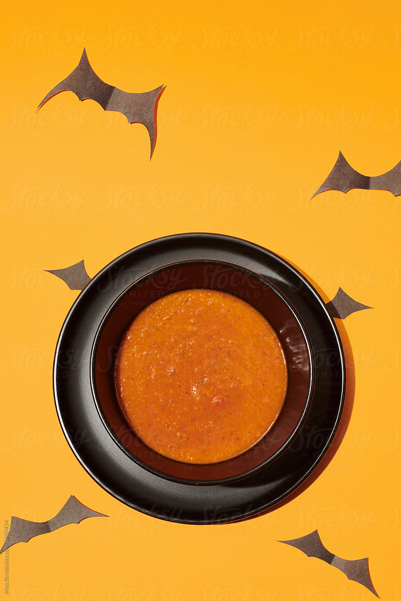 bowl of tomato soup decorated for Halloween