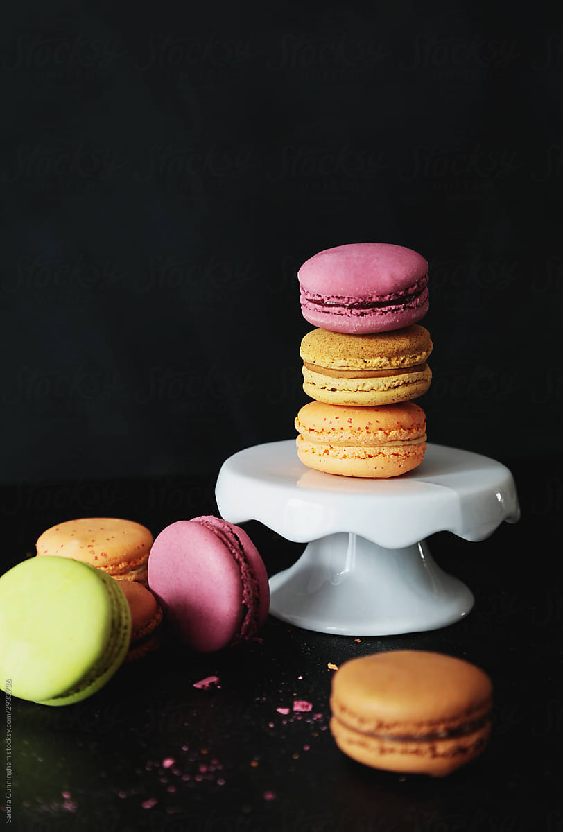 Colorful french macaroons on dark background