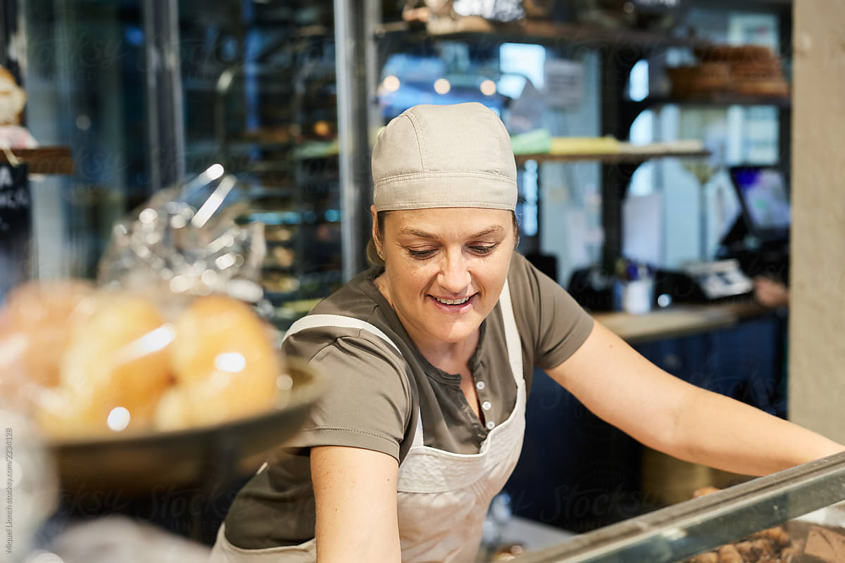  Saleswoman In A Bakery By Stocksy Contributor Miquel Llonch Stocksy