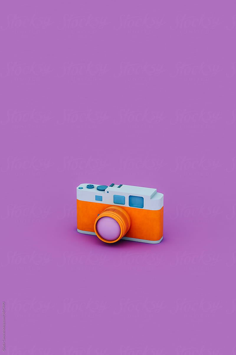 an Orange and blue camera on violet background