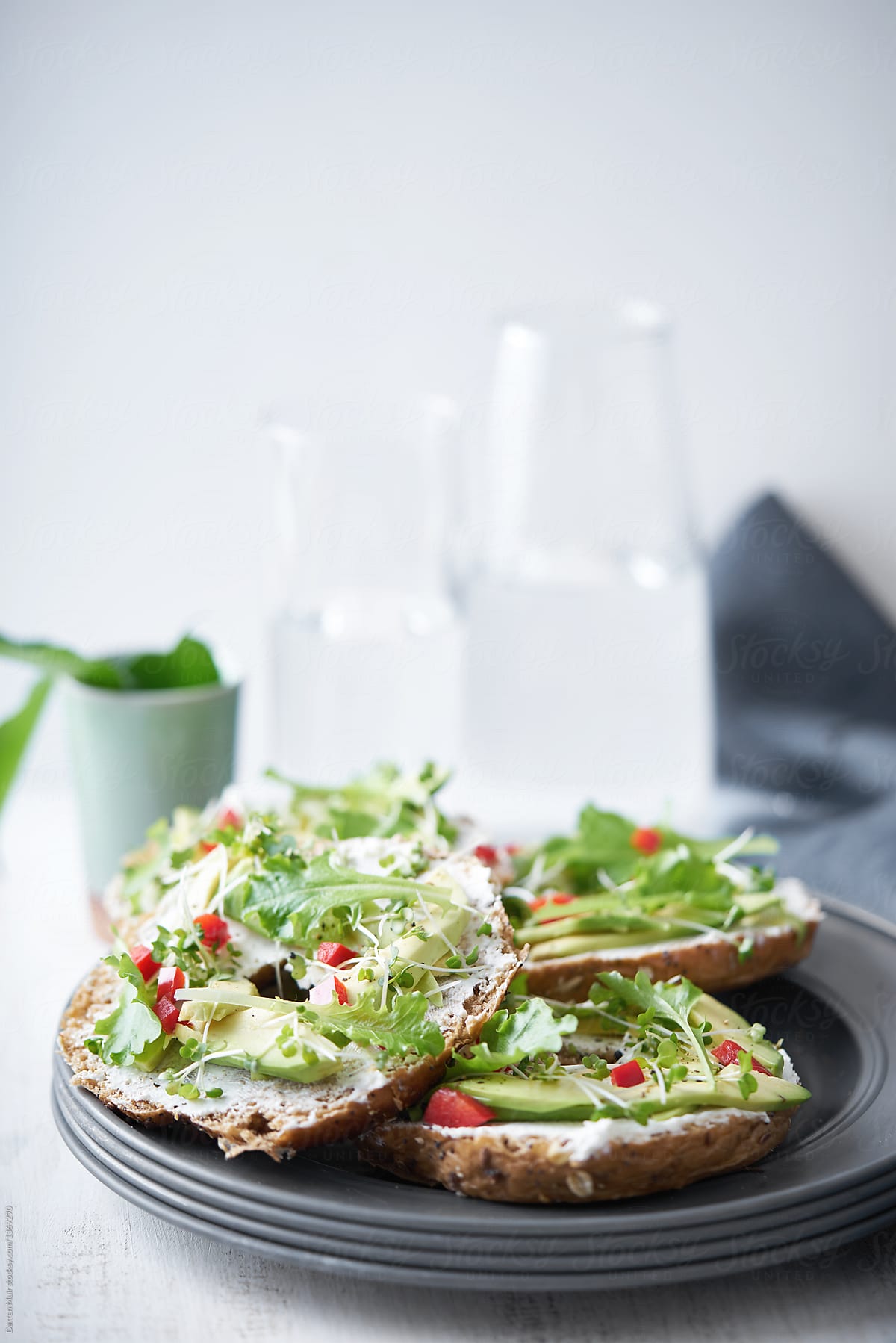 Wholemeal bagels with cream cheese and avocado salad.