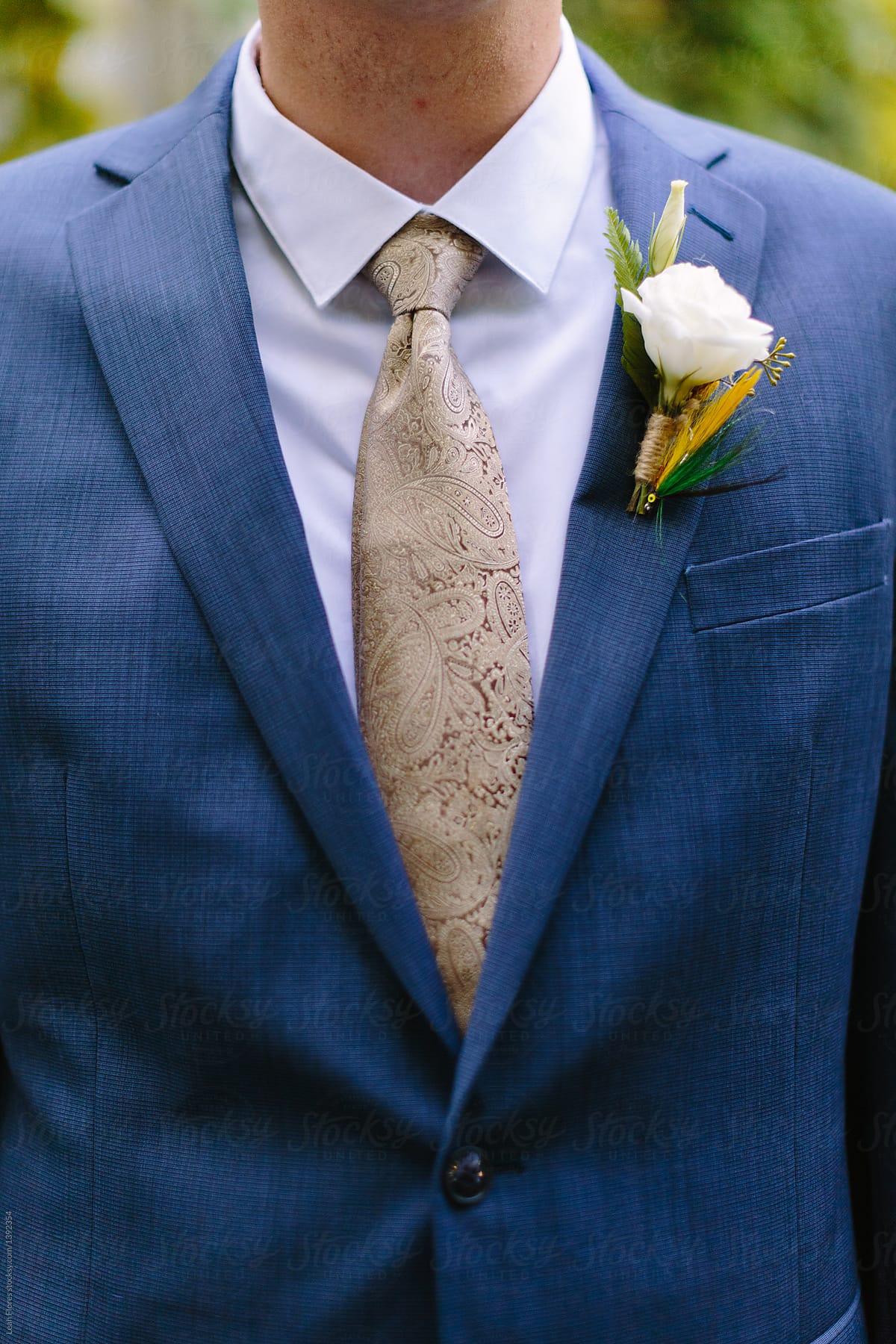 Groom Wearing Tie And Fly Fish Boutonniere by Stocksy Contributor