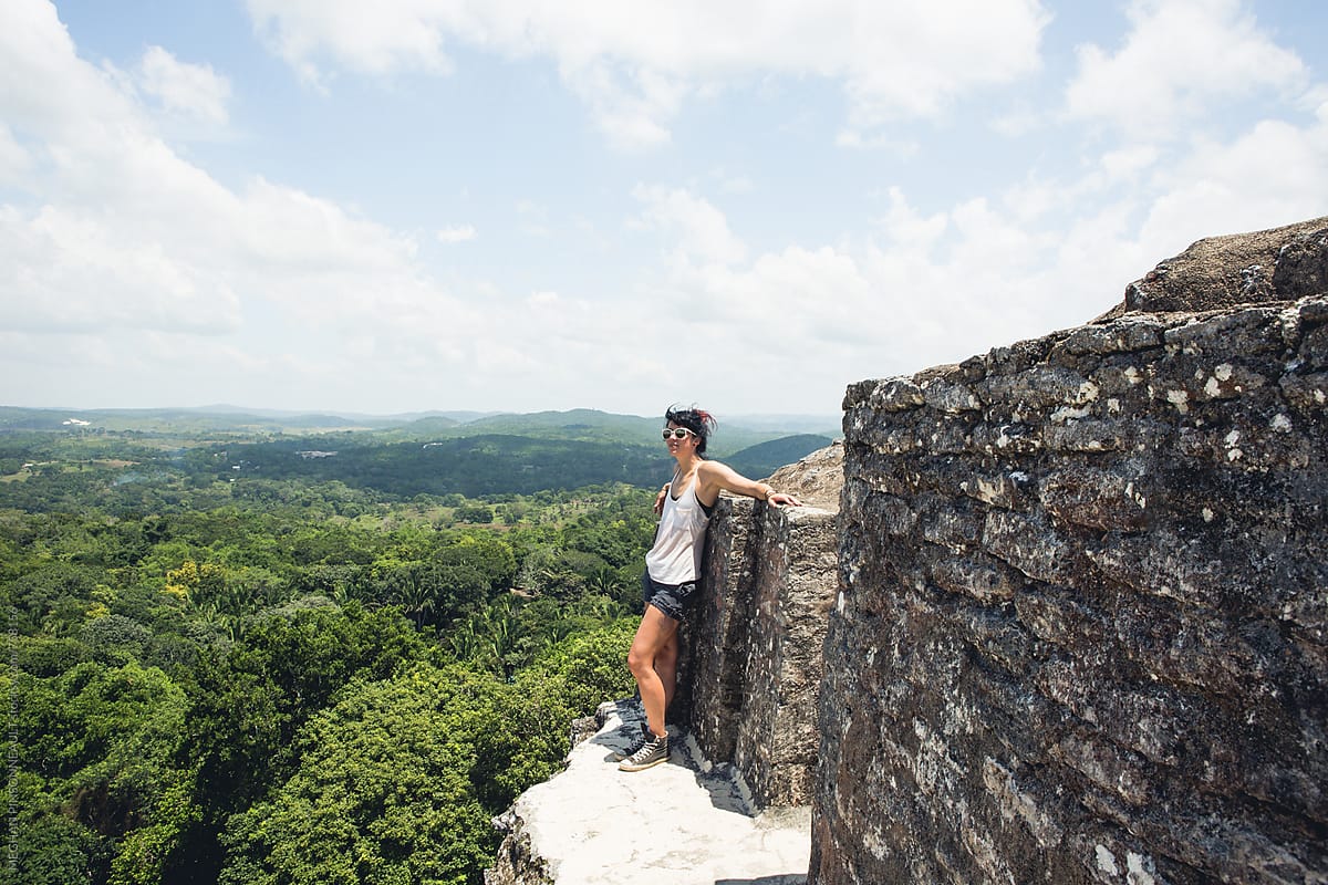Woman Relaxing on Top of Ancient Mayan Temple