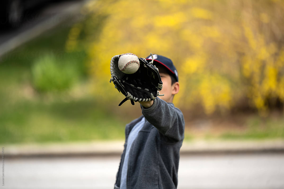 Little kid catching baseball
