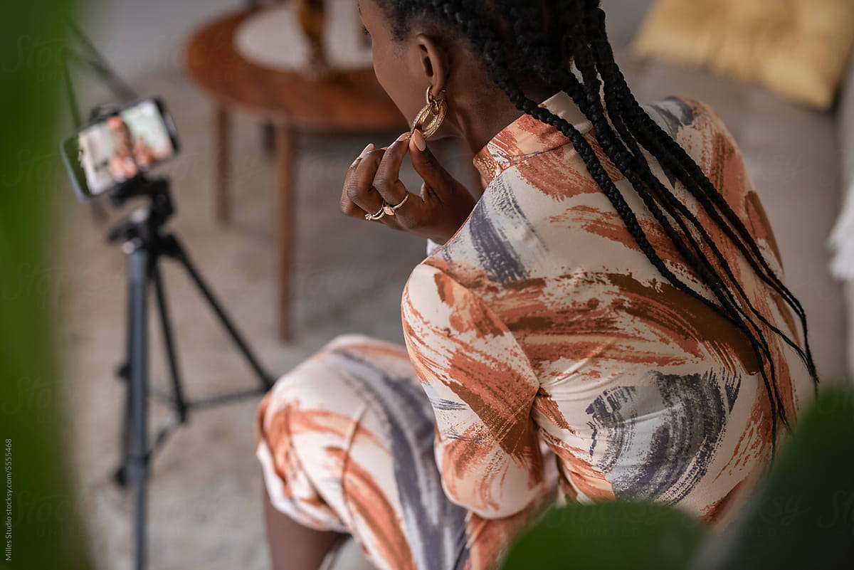 Black female blogger sharing opinion on earrings