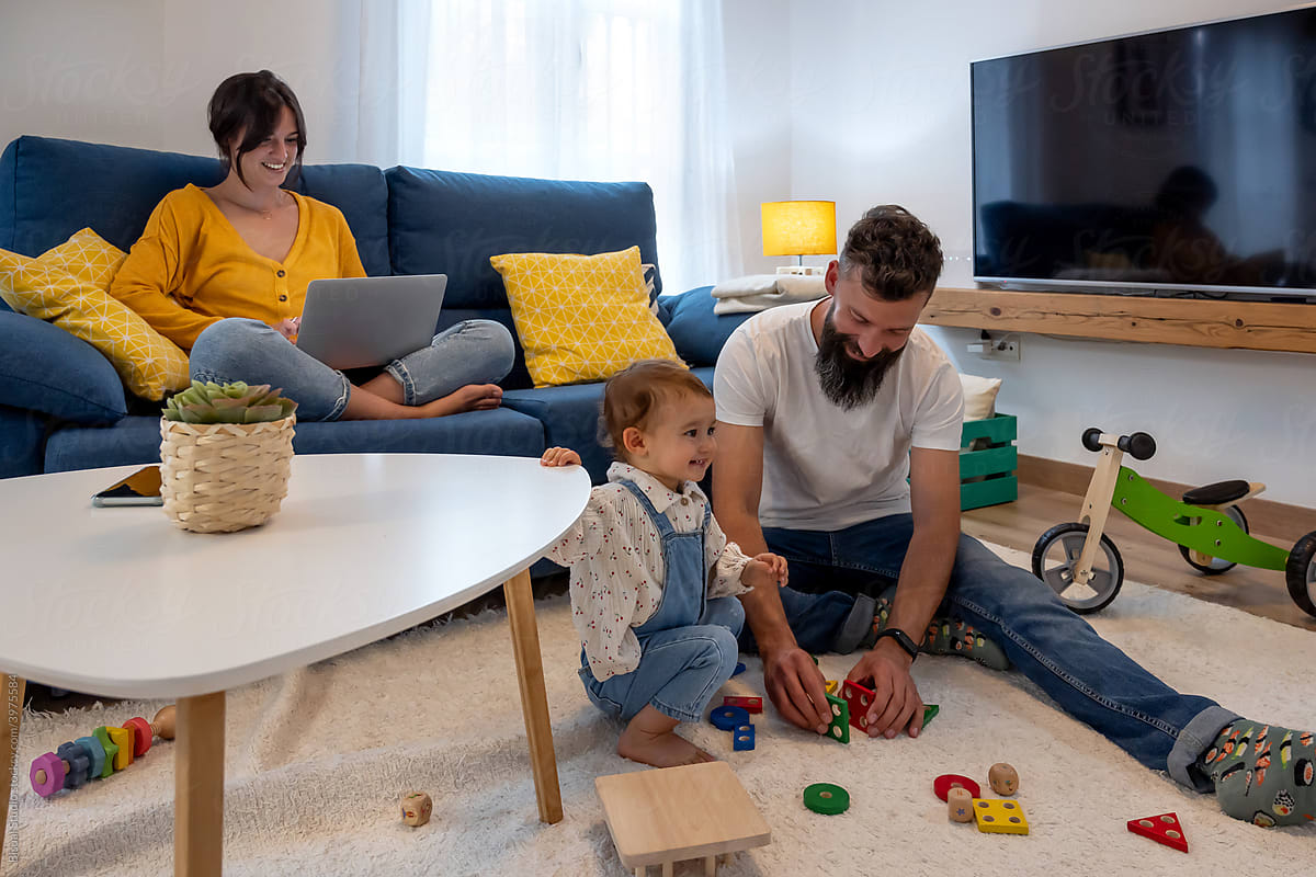 Happy family spending time in living room together