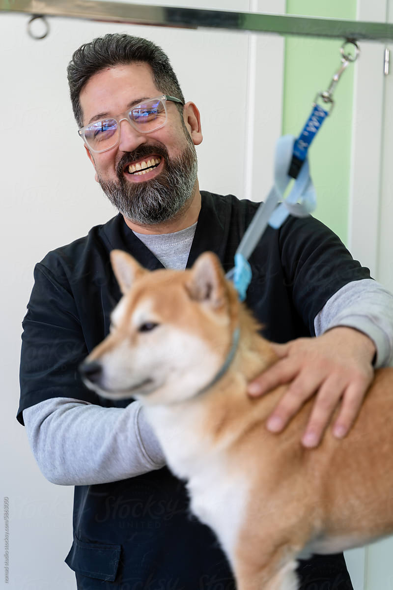 Man smiling while working in a vet.
