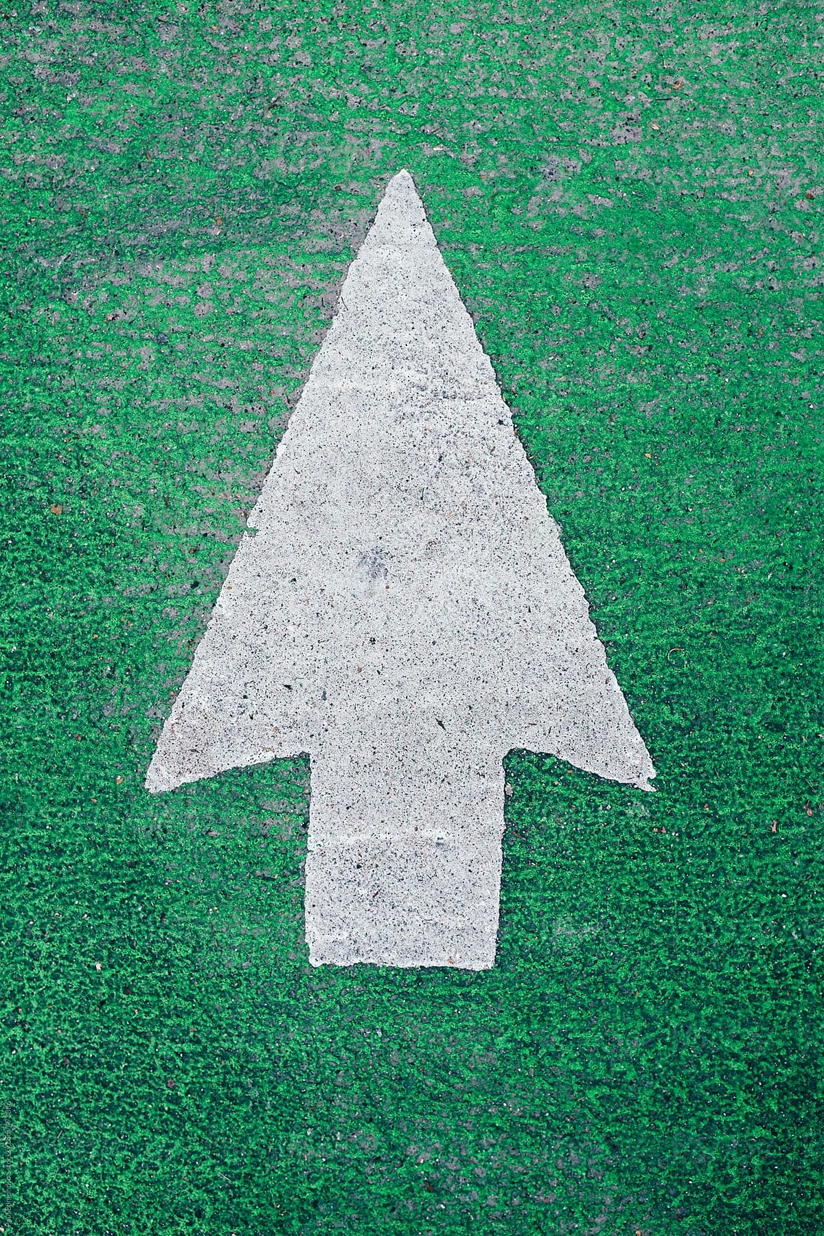 Arrow symbol on urban street and bike lane