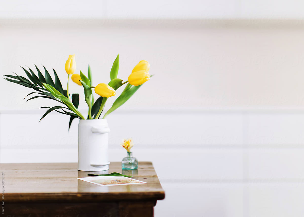 Bouquet of yellows tulips in minimal white kitchen