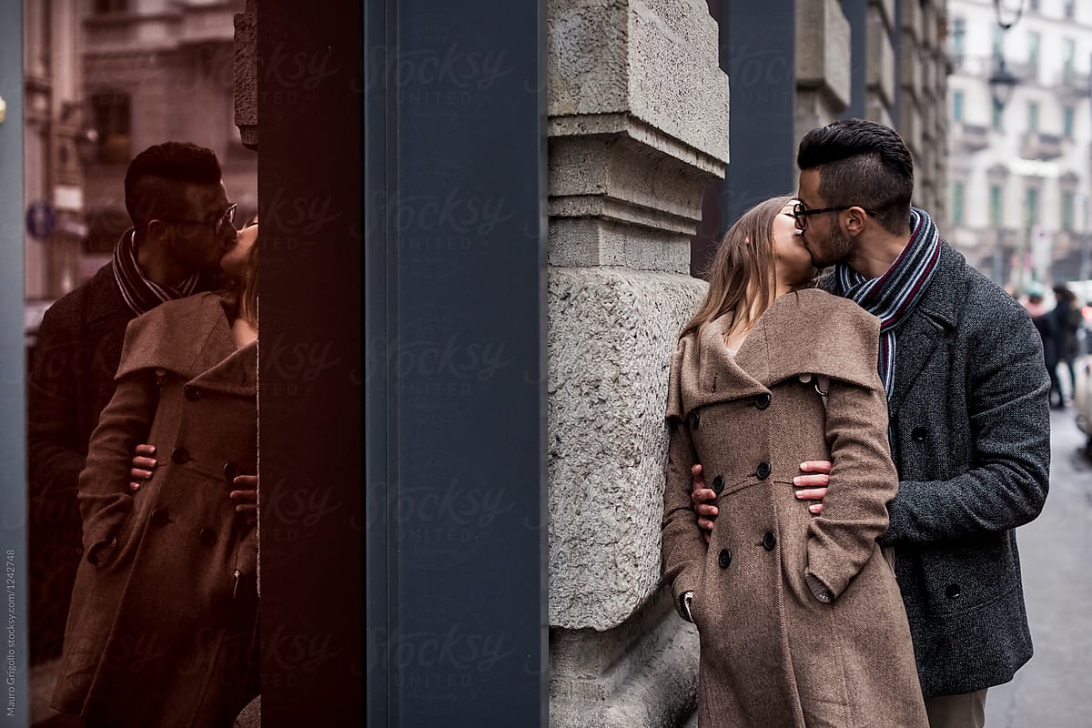 Couple kissing in the city in winter