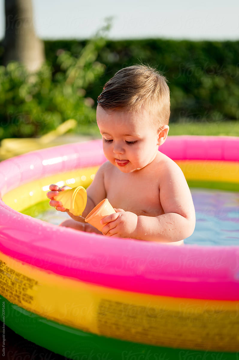 Baby playing in pool