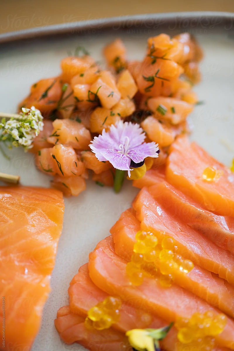 Plate of salmon with some flowers