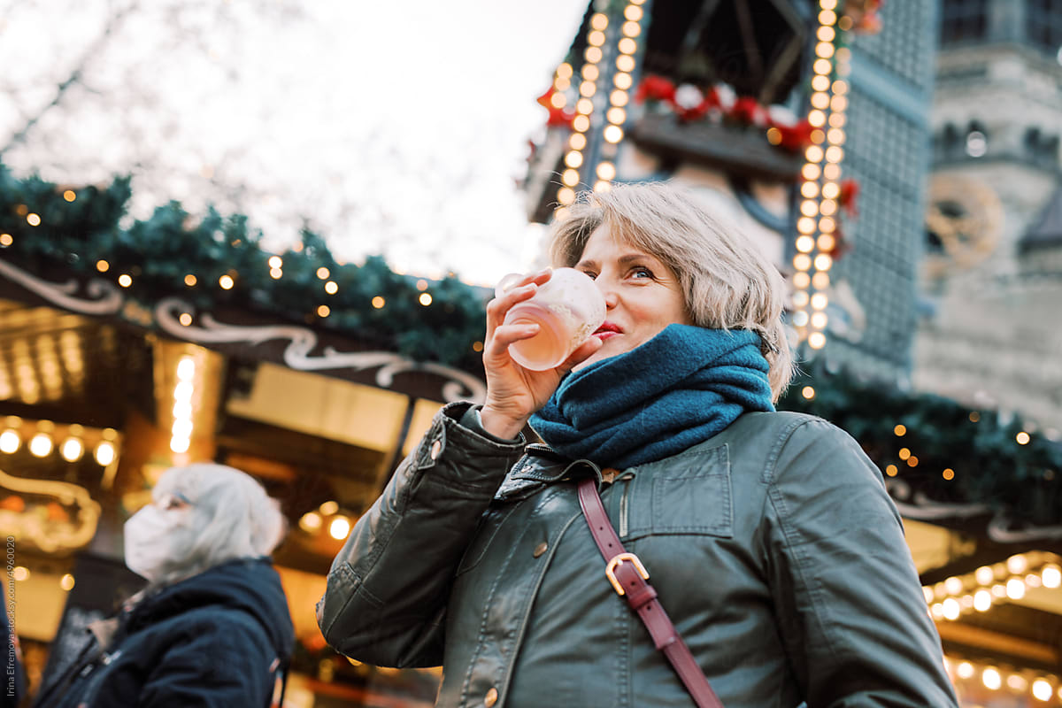 Savoring the Season: Woman Enjoying Hot Wine