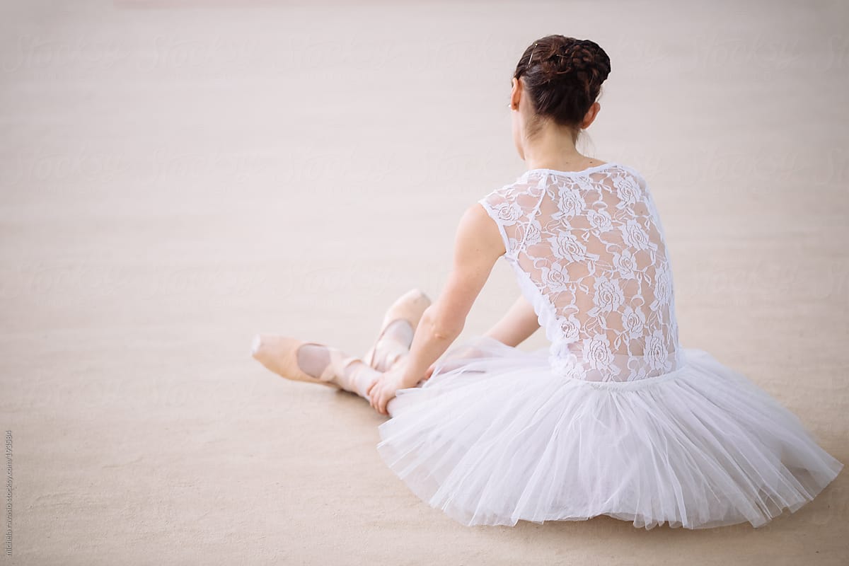 Ballet dancer resting on the floor