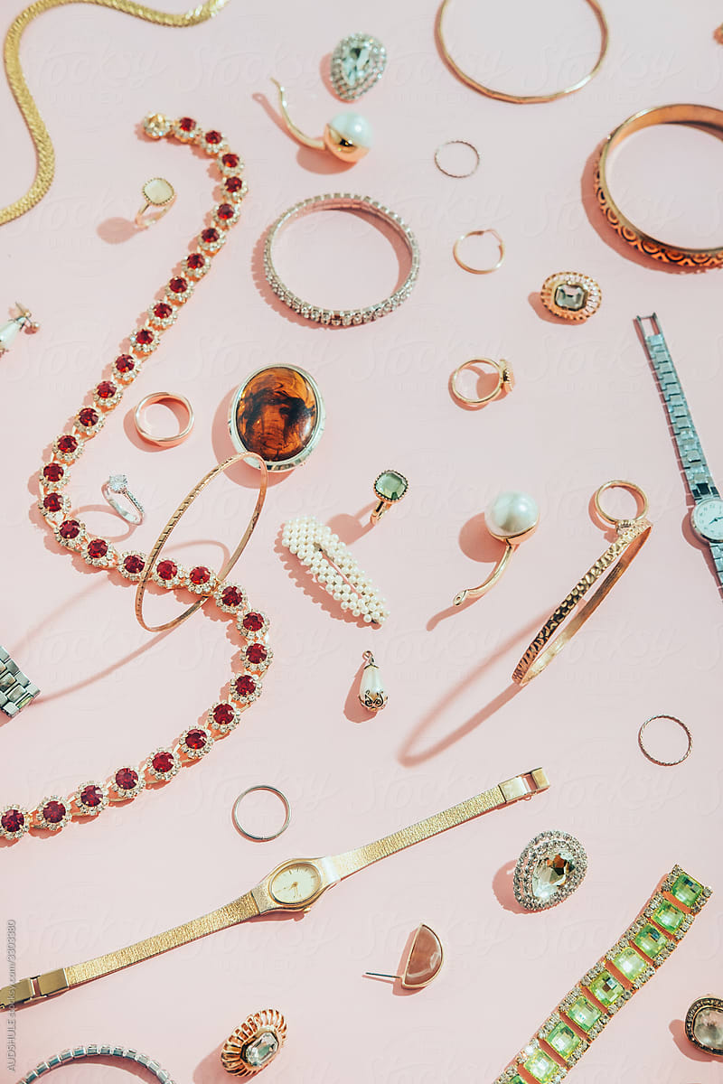 Jewellery,diamonds, ruby, gold, silver  etc/ on pink background