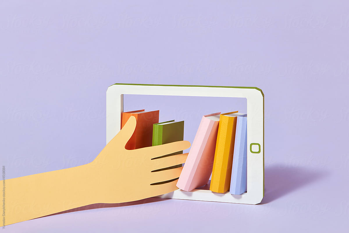 Hand takes books from tablet