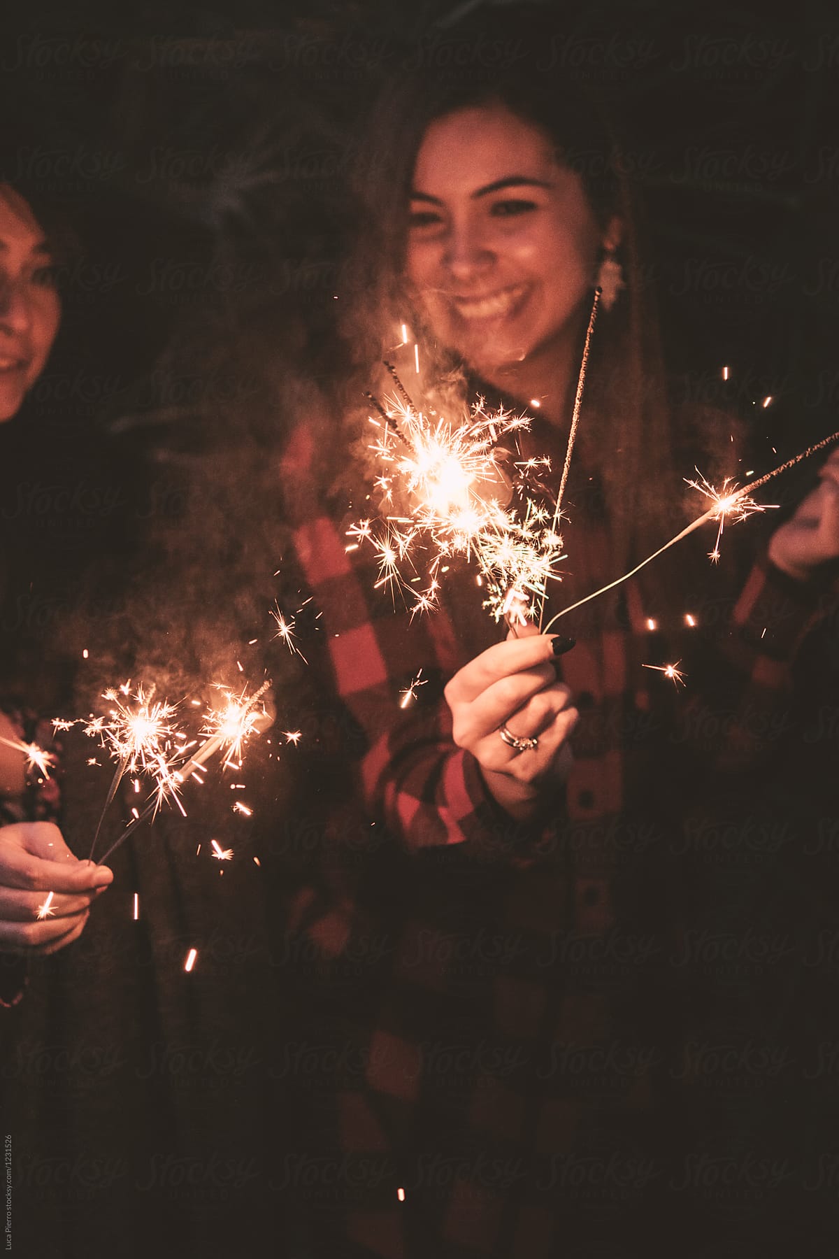 «two Woman Having Fun With Sparklers At A Party Del Colaborador De