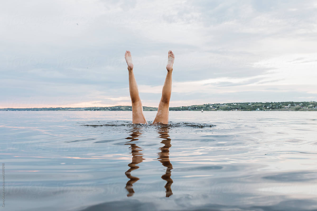 Swimmer Doing Handstands In The Water By Stocksy Contributor Carey Shaw Stocksy