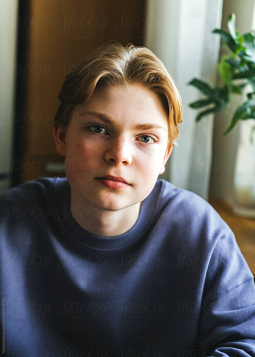 A teenager with blond hair.